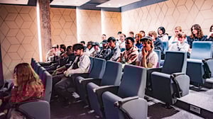 A class of students in the lecture theatre at dBs Manchester