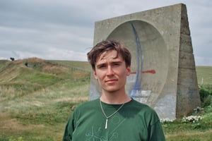 A picture of Patrick standing beside an old World War 2 concrete array